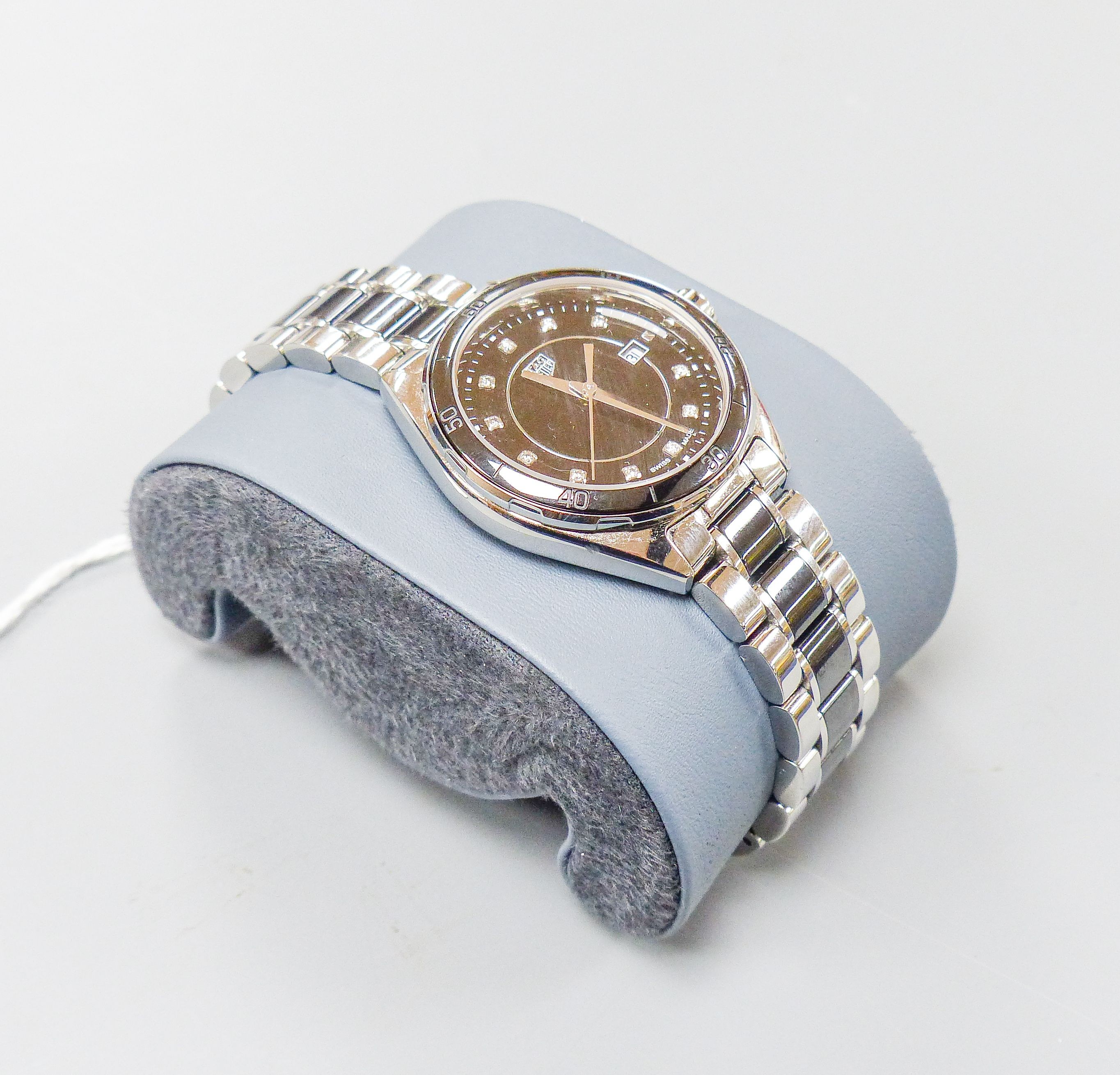 A modern stainless steel Tag Heuer quartz wrist watch with diamond dot numerals, case diameter 32mm, with box.